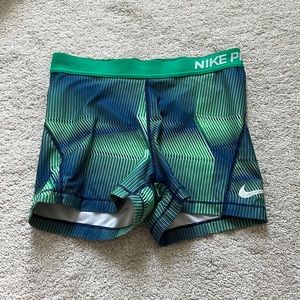 Green and blue patterned Nike pros